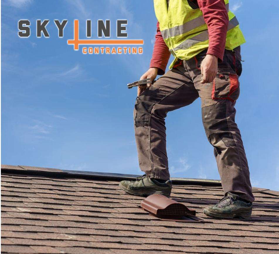 worker on top of roof wearing safety gear Skyline Contracting in Gainesville, GA