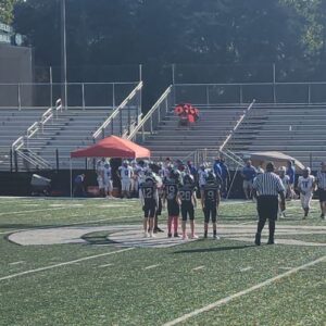 A group of Jr Football players on the field in Gainesville