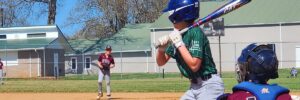 Image of children playing baseball in a baseball fild in Gainesville, GA