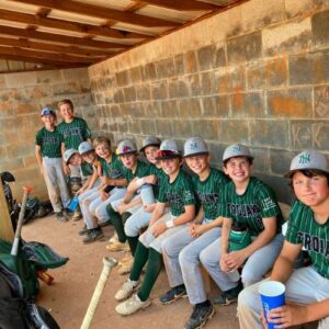 Jr Trojan Baseball Team sitting on the bench in Gainesville, GA